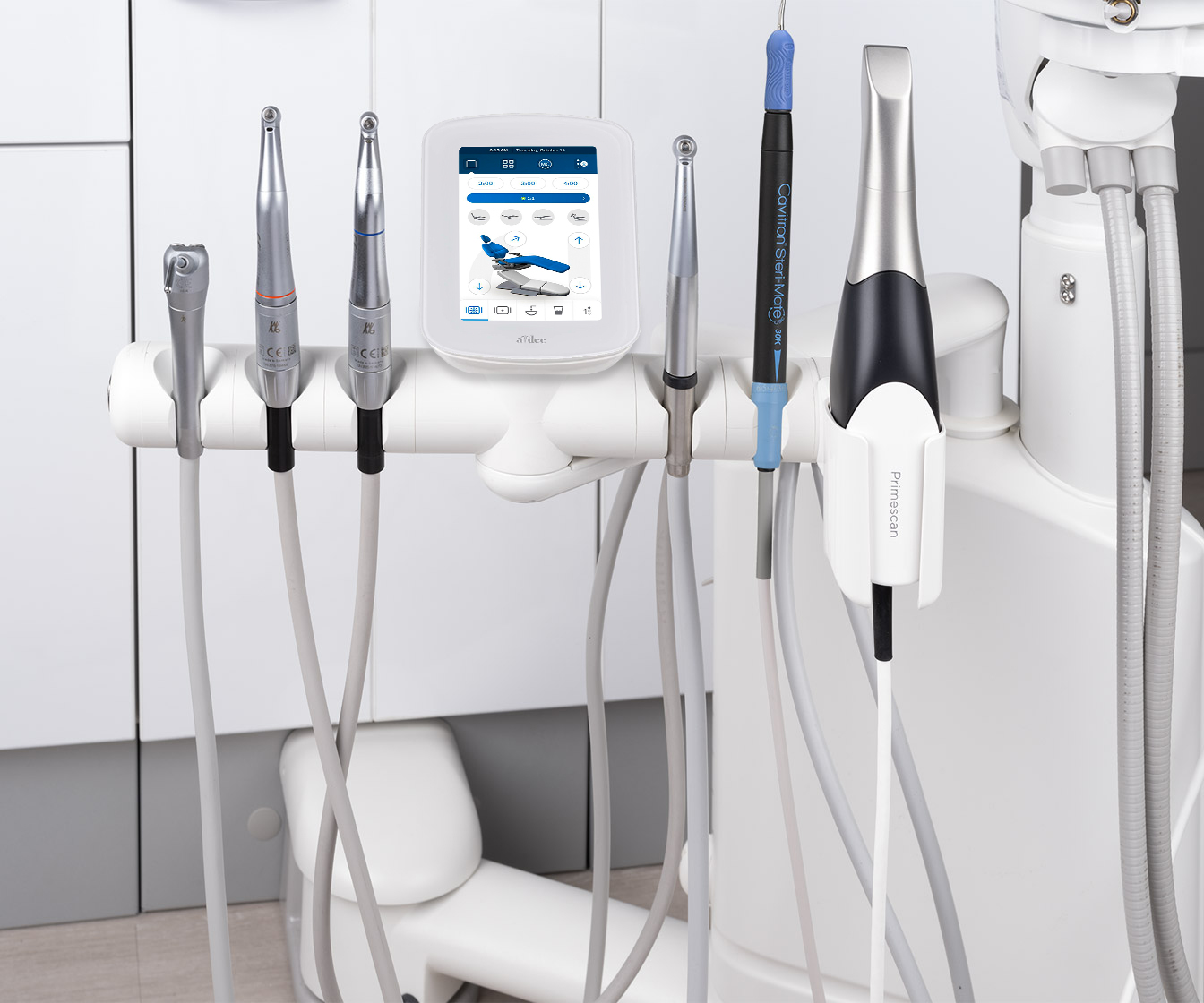 Clinical handpieces integrated with an A-dec 341 12 o'clock duo delivery system with a CP5i touchpad