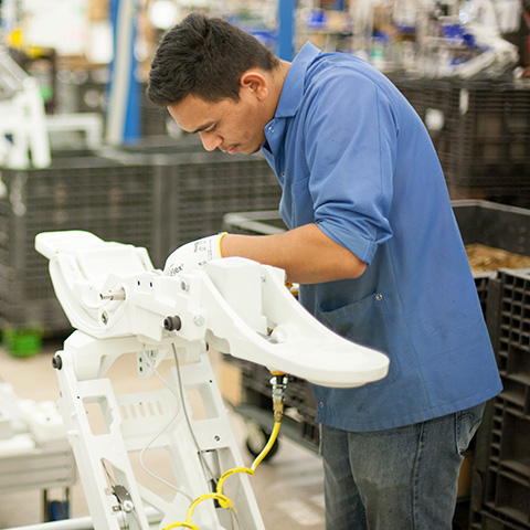 A-dec employee at work manufacturing dental equipment 