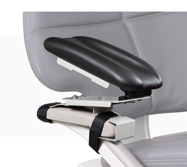 A-dec IV Armboard mounted to an A-dec dental chair with black upholstery