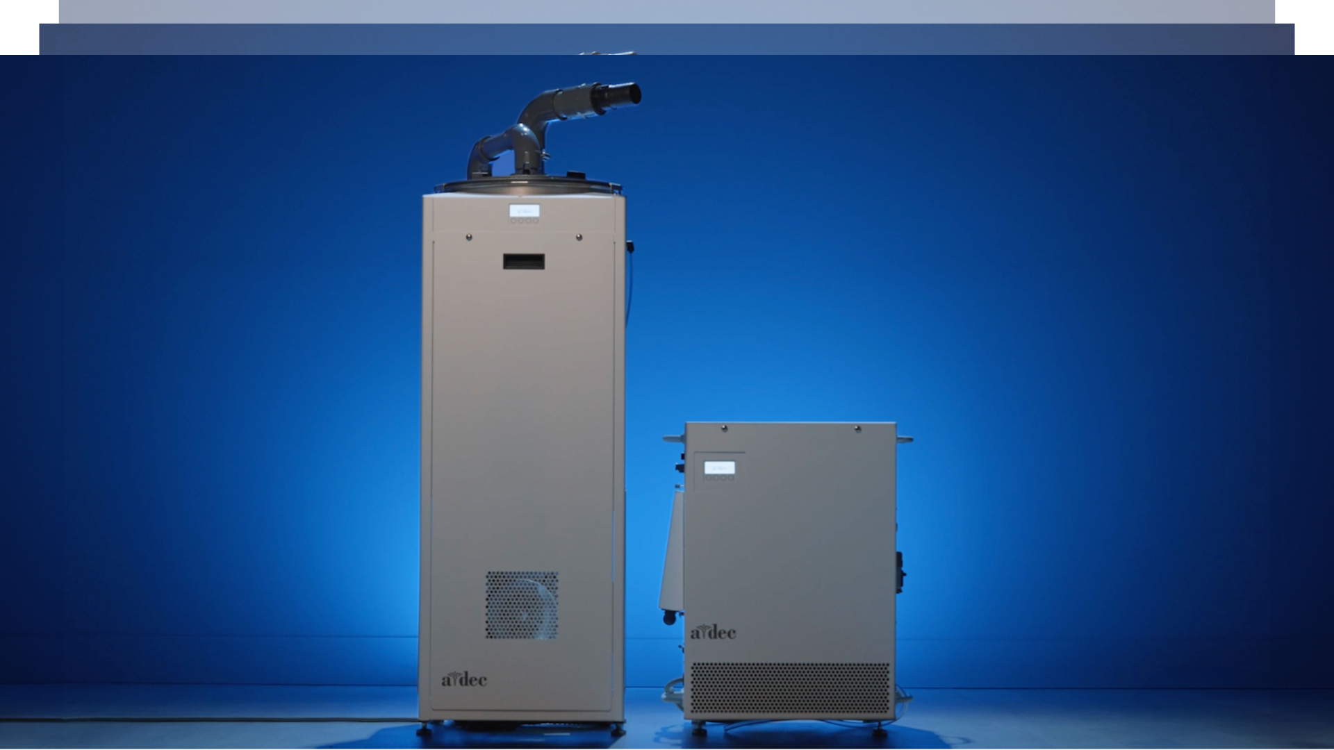 Stacked cards showing A-dec QuietCore+ dental vacuum and air compressor in blue-lit studio for support video playlist