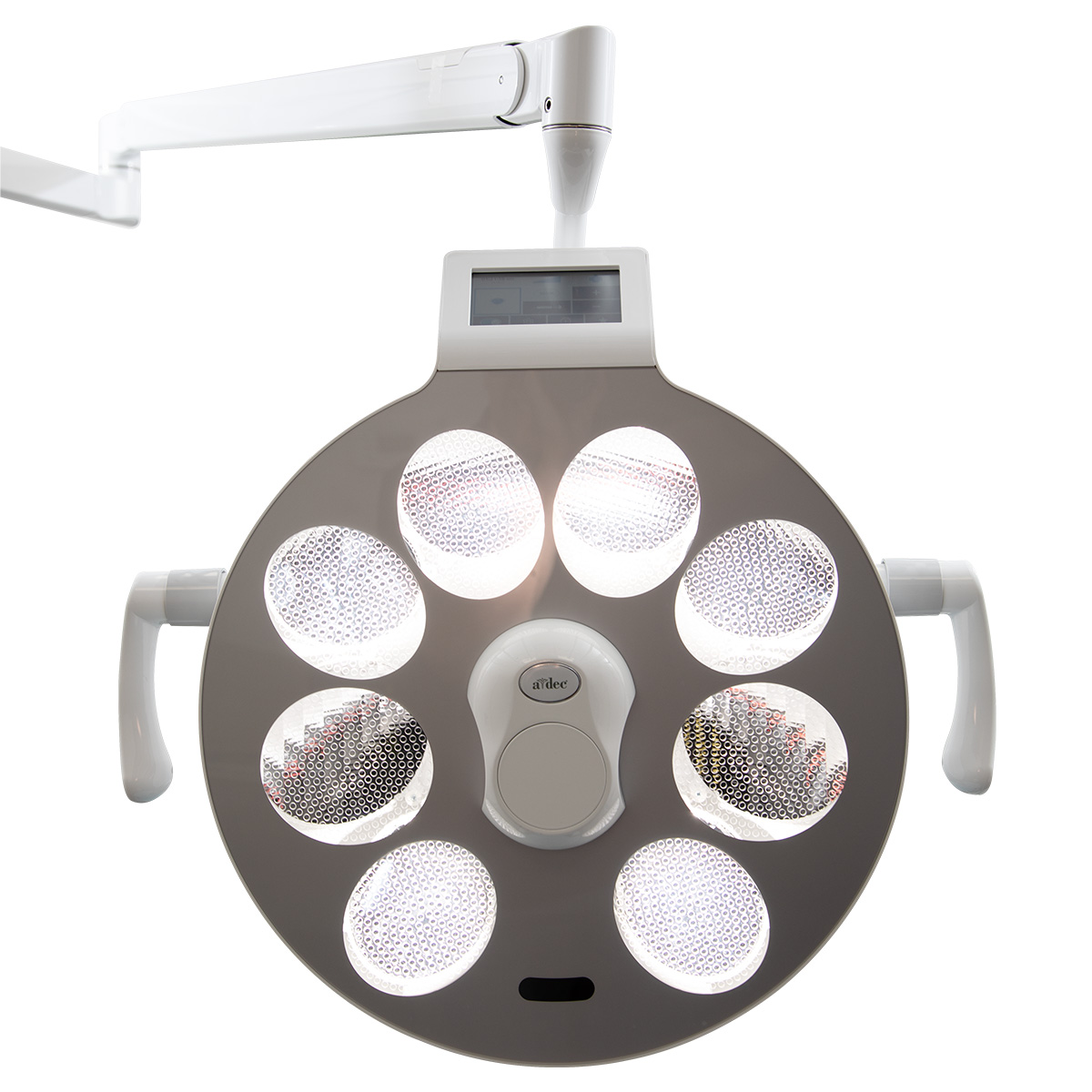Image showing the A-dec surgical light positioned over a dental chair in an operatory
