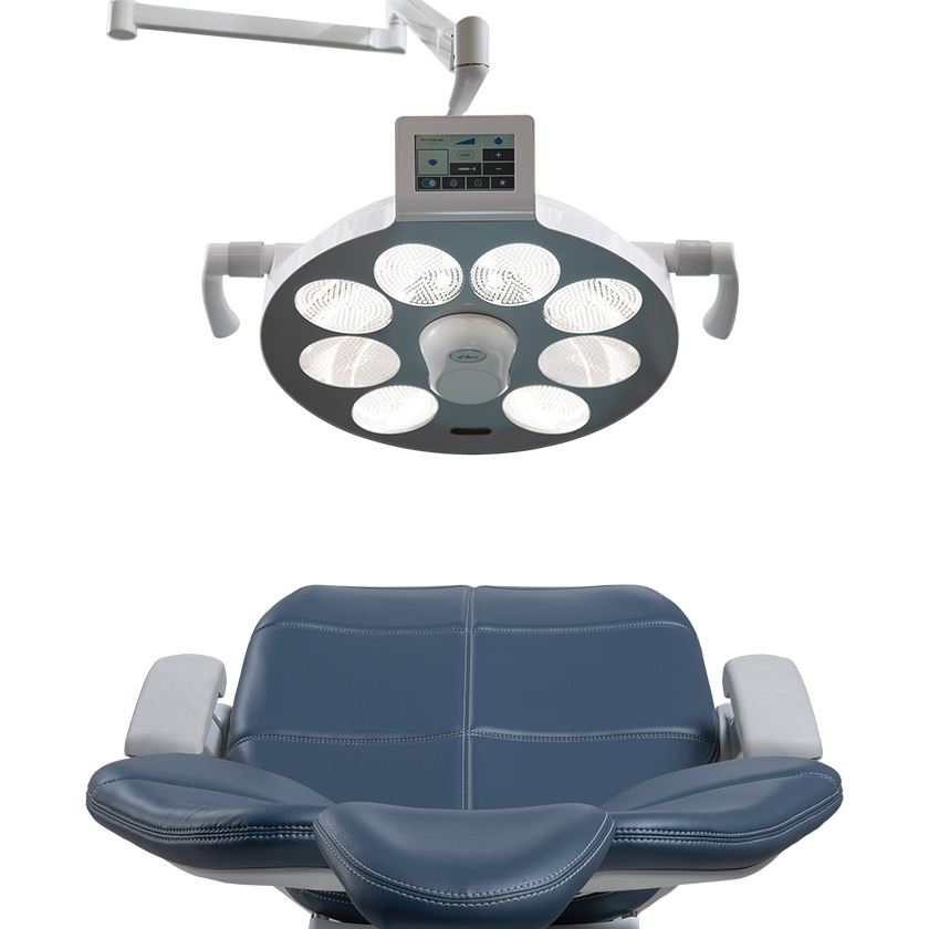 A-dec Surgical Light mounted on the ceiling over an A-dec dental chair