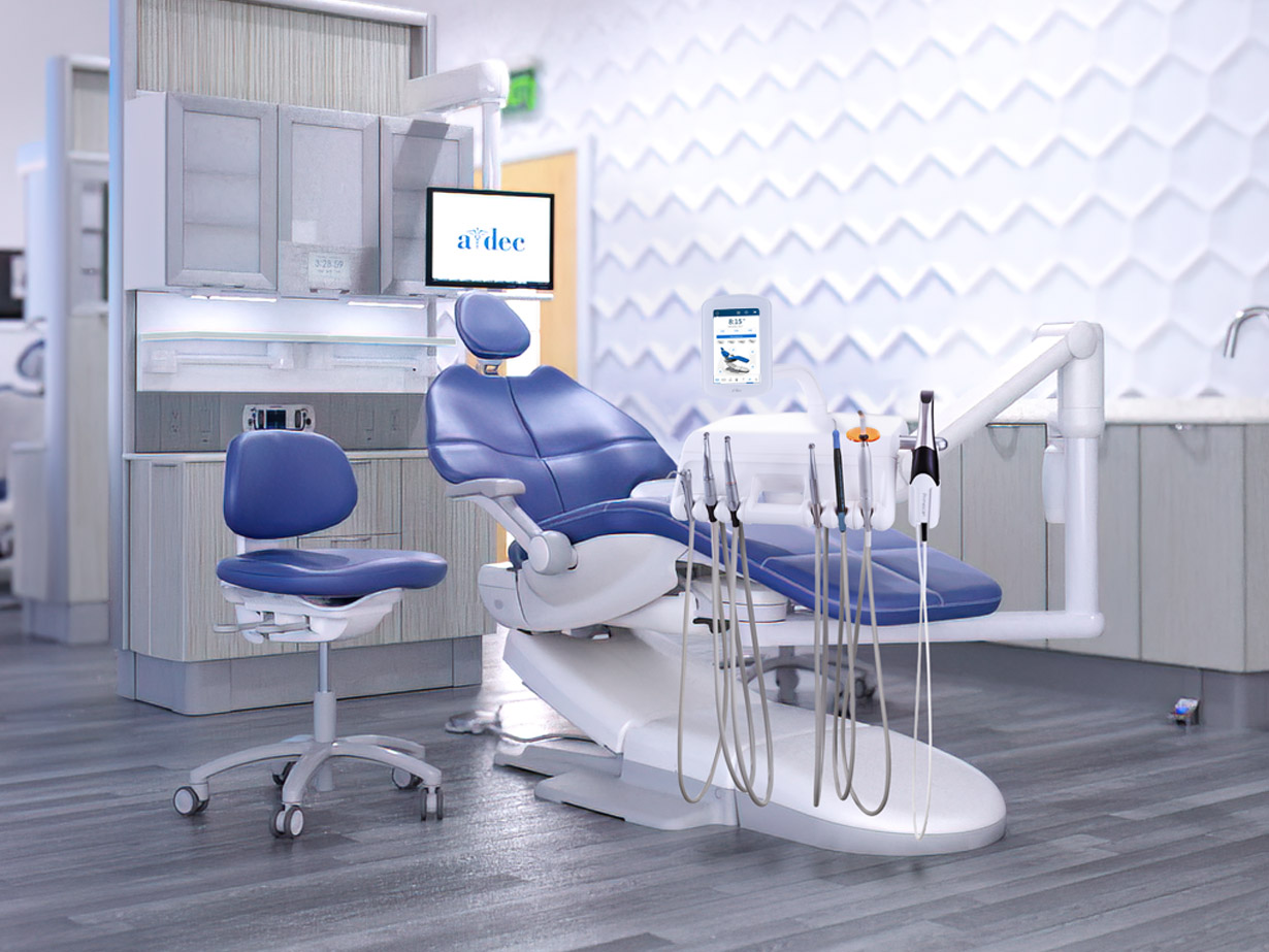 Clean operatory with A-dec dental chair and various integrated dental devices