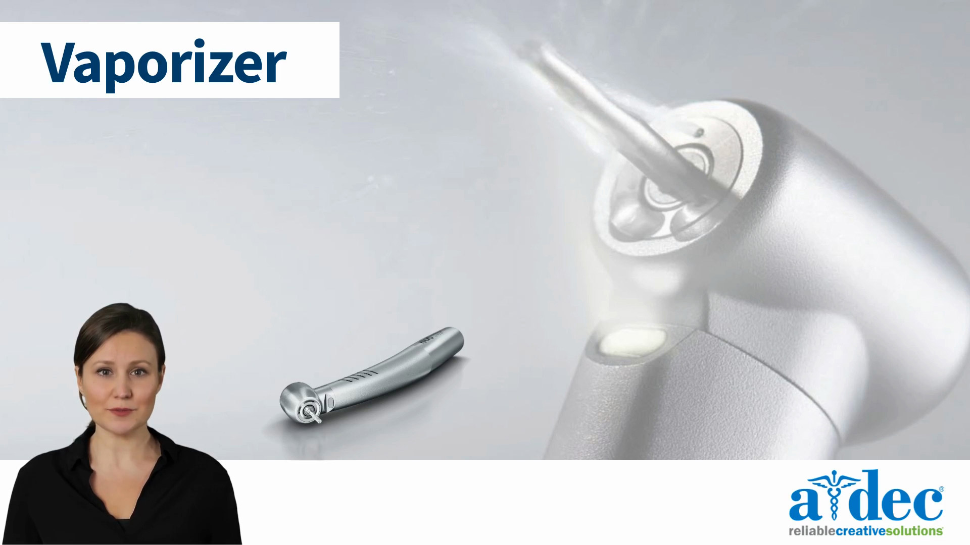 A technician demonstrates how to use the vaporizer function on a dental handpiece