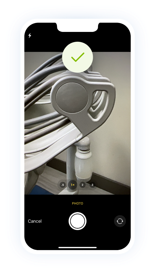 Phone taking a focused photo of A-dec parts